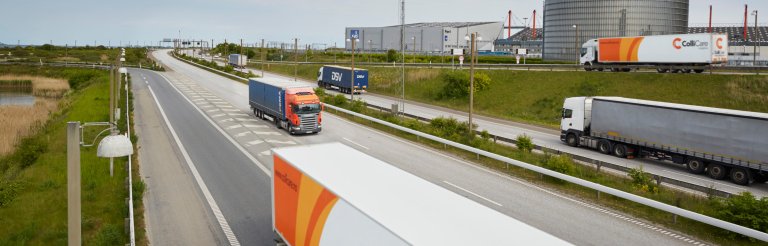 ColliCare trucks driving on a highway.