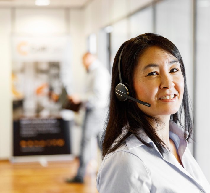 A ColliCare employee in the customer service team ready to answers questions from customers